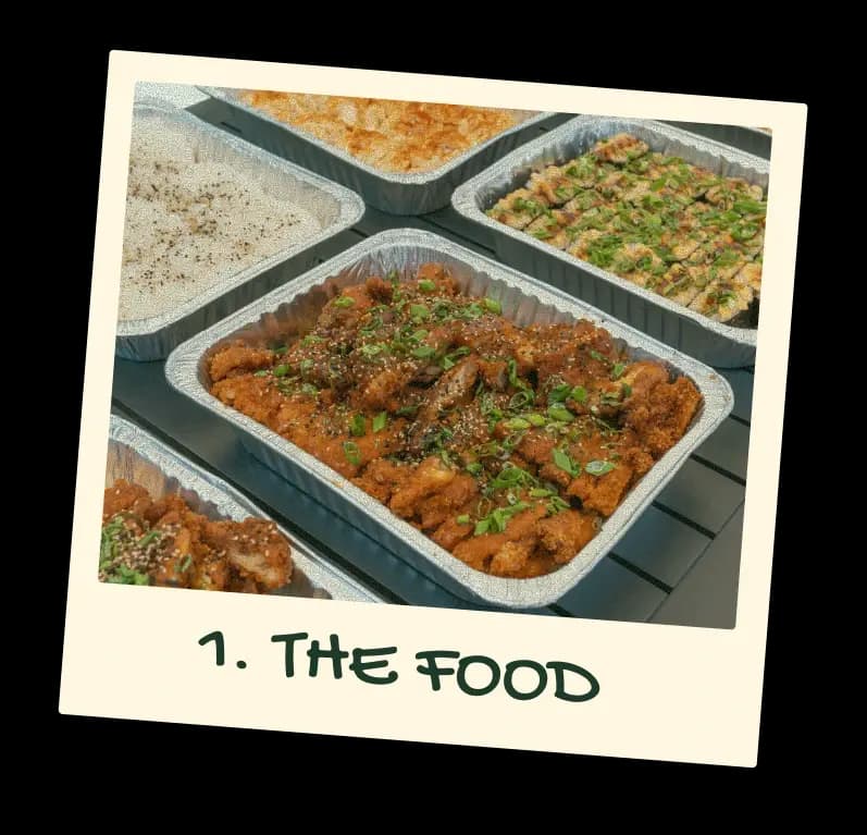 Polaroid captioned “1. The food”: trays of kimchi butter katsu, rice and musubi
