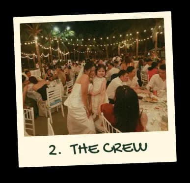 Polaroid captioned “2. The crew”: a packed evening party under string lights